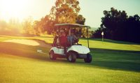 Golf cart, men and drive with game, practice and weekend for hobby or bonding together. People, friends and buggy for transportation with sport club, golfing course or outdoor with equipment or flare