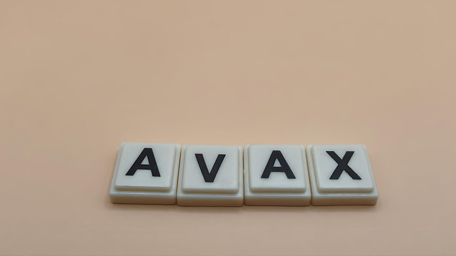 AVAX (Avalanche) crypto token name on white block letters.
