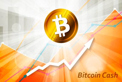 Bitcoin cash cryptocurrency in the bright rays on background with statistics chart and arrow going up