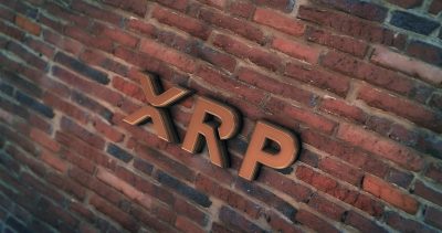 Golden Xrp Coin Symbol 3D Illustration of Stone Wall Background. Golden Xrp Coin Logo. Xrp Coin Sign. 3D Rendering.