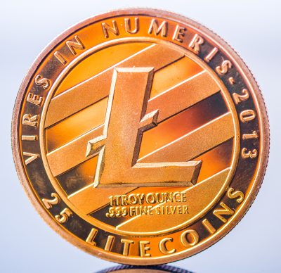 Physical version of Litecoin, new virtual money. Conceptual image for worldwide cryptocurrency and digital payment system called the first decentralized digital currency