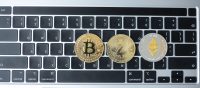 golden and silver Cryptocurrency on keyboard laptop, Bitcoin , Ethereum, Zcach coins. Crypto is Digital Money within the blockchain network