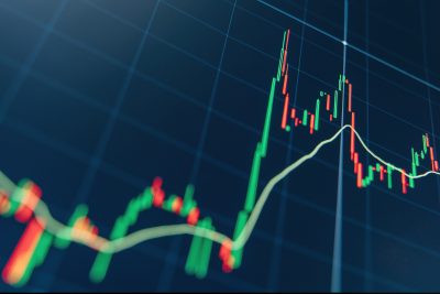 Crypto trading market volatility with technical price graph and indicator, red and green candlesticks for analysis up and downtrend of stock market on blue display. Financial diagram.