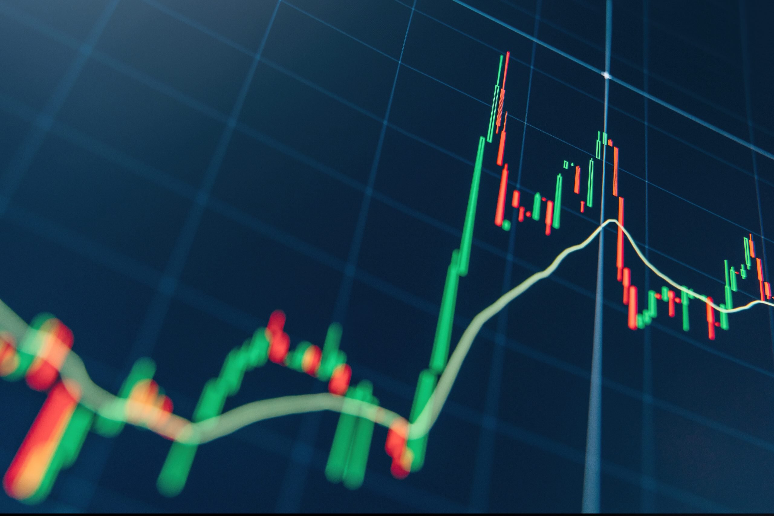 Crypto trading market volatility with technical price graph and indicator, red and green candlesticks for analysis up and downtrend of stock market on blue display. Financial diagram. 