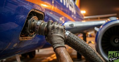 Macro industrial shots create a sense of tactile reality and high stakes. By focusing on the physical point of fuel transfer, the image visualizes where revenue is literally being consumed, using high-contrast metallic textures to stop the scroll.