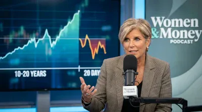 A woman with short blonde hair and a patterned beige blazer speaks into a black microphone. Behind her, a large blue screen displays a financial graph showing an upward trend labeled '10-20 YEARS' and a shorter, volatile downward trend labeled '20 DAY'. To the right, a bright white 'Women & Money Podcast' logo is visible on a blue-green background.